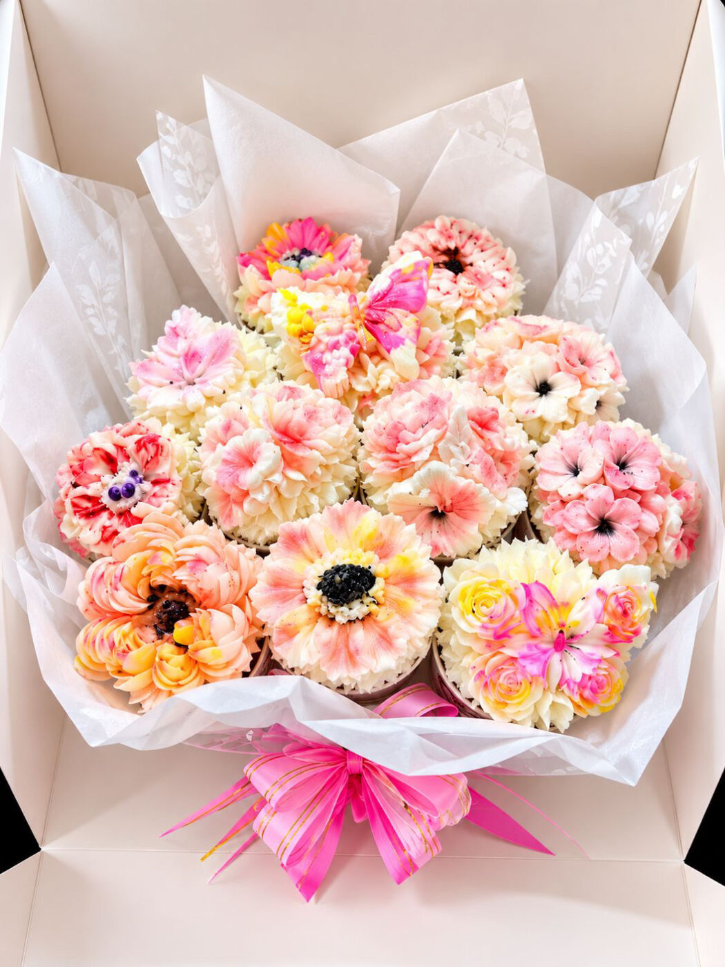 Blush pink and peach twelve cupcake bouquet in a white gift box with pink ribbon, Gold Coast